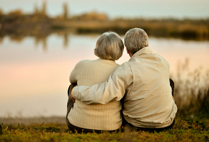 Mature singles walking together in a relaxed outdoor setting