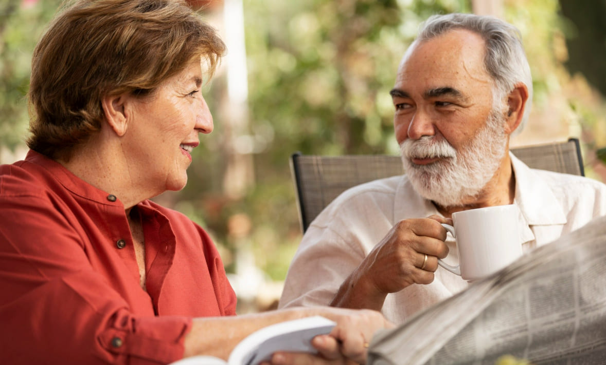 Mature couple having a calm conversation over coffee