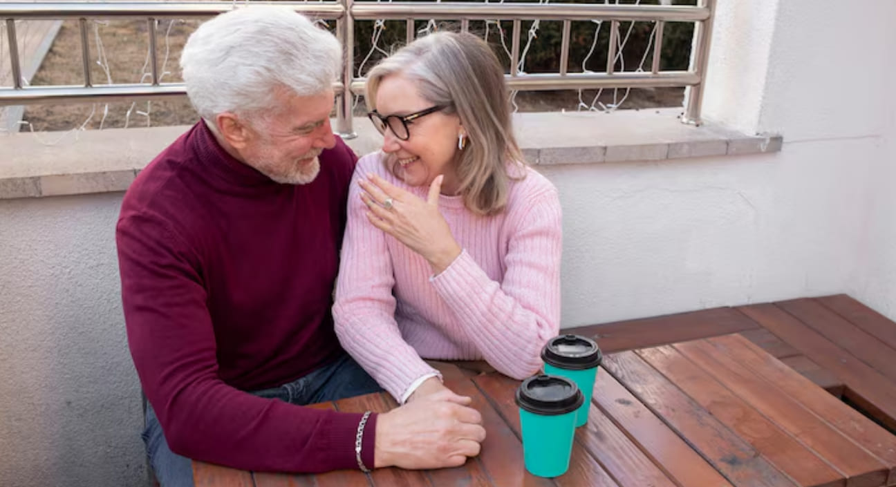 Mature couple enjoying a warm coffee conversation together
