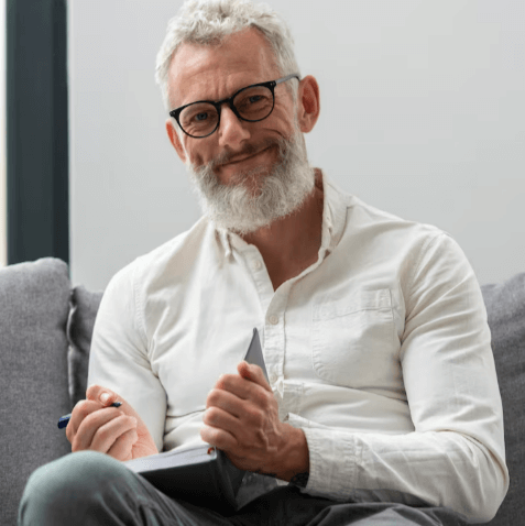 Mature man in a bright casual portrait with a relaxed expression