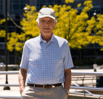 Older man with a friendly smile in a relaxed everyday setting