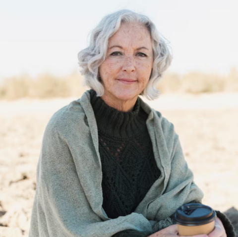 Older woman with a warm expression in a casual setting
