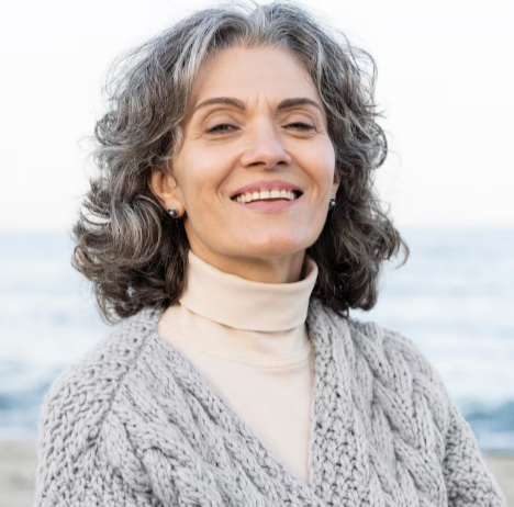Profile portrait of a mature woman with a relaxed smile