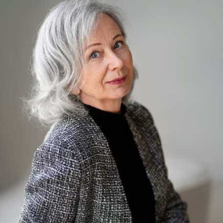 Profile portrait of an older woman in a comfortable everyday setting