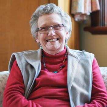 Mature woman smiling in a relaxed home setting